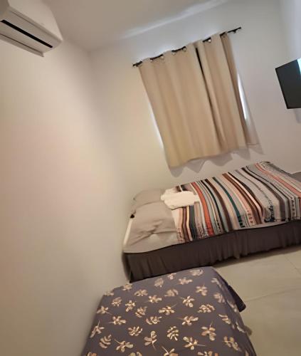 Katil atau katil-katil dalam bilik di Flat Térreo em Meio a Natureza