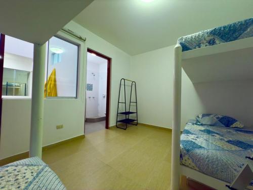 Un pat sau paturi într-o cameră la Beach house Sol Mar y Relax