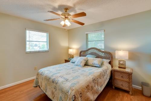a bedroom with a bed and a ceiling fan at Coastal Oasis with Shared Pool, 2 Mi to Beach! in Englewood