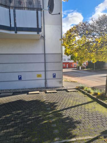 a door of a building on a street at WellandHome Aalen - XXL Deluxe Apartment in Aalen