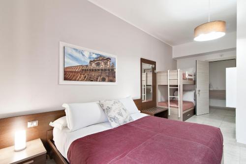 Ein Bett oder Betten in einem Zimmer der Unterkunft B&B Kalurya - Lecce Selection