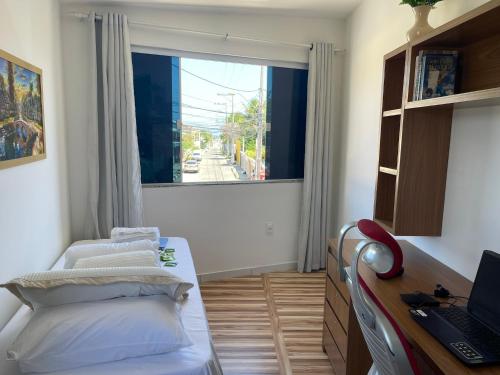 Ένα ή περισσότερα κρεβάτια σε δωμάτιο στο Praia de Ipitanga - Perto do Aeroporto