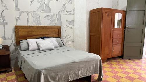 Ένα ή περισσότερα κρεβάτια σε δωμάτιο στο Casa Esperanza