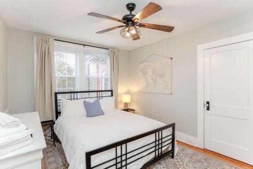 a bedroom with a bed and a ceiling fan at Sojourn at Colley Manor Unit 5 in Norfolk