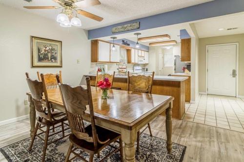 a dining room and kitchen with a table and chairs at Branson Condo on Thousand Hills Golf Course with Indoor Pool and Hot Tub in Branson