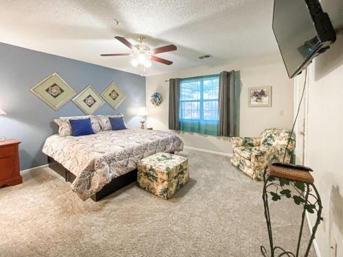 a bedroom with a bed and a ceiling fan at Branson Condo on Thousand Hills Golf Course with Indoor Pool and Hot Tub in Branson