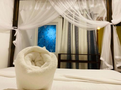 Ένα ή περισσότερα κρεβάτια σε δωμάτιο στο Tropical Room light