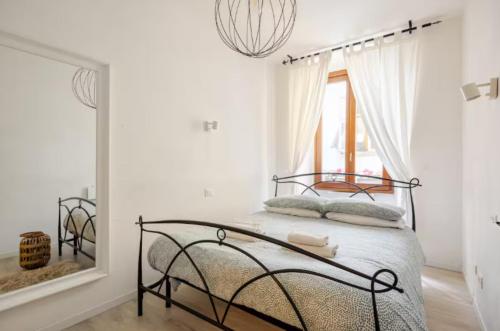 Ένα ή περισσότερα κρεβάτια σε δωμάτιο στο Dolce Riva Downtown apartment