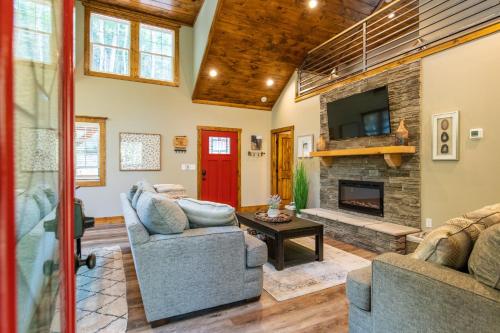 a living room with two couches and a fireplace at Dreamscape in Rogers