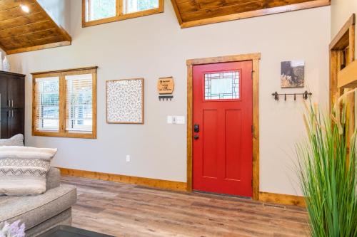 a red door in a living room with a couch at Dreamscape in Rogers
