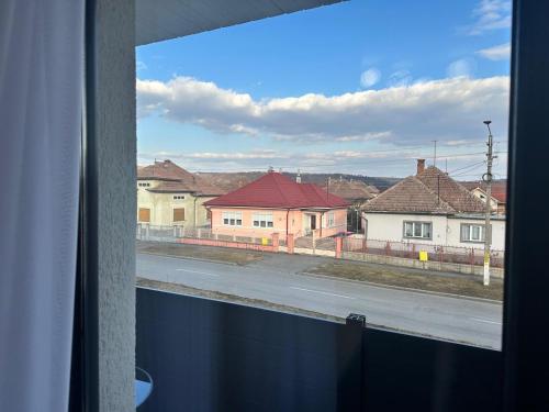 a view from a window of a street with houses at Pensiune cu restaurant Bigfast in Luduş