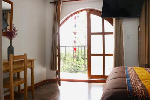Postel nebo postele na pokoji v ubytování Casa Munayki
