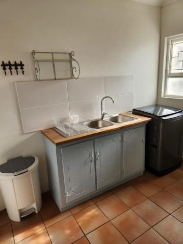 Una cocina o zona de cocina en At Let se Plek