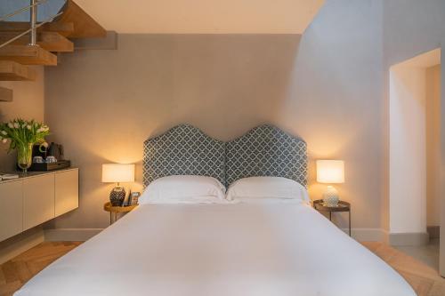 Ένα ή περισσότερα κρεβάτια σε δωμάτιο στο Villa Conrad