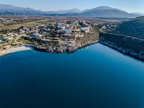 an aerial view of a town next to a body of water at Villa La Quiete - Adults only in Ksamil