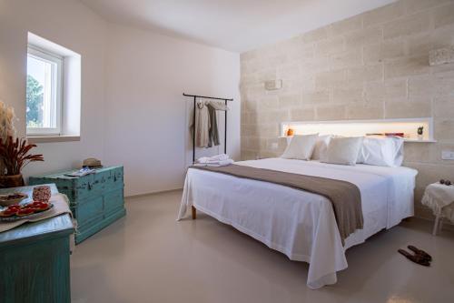 Ένα ή περισσότερα κρεβάτια σε δωμάτιο στο Heres - Trulli experience
