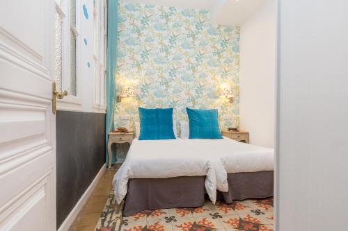 Posteľ alebo postele v izbe v ubytovaní Central Suites Barcelona