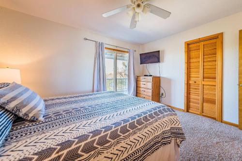 a bedroom with a bed and a window at Sound Waves in Duck