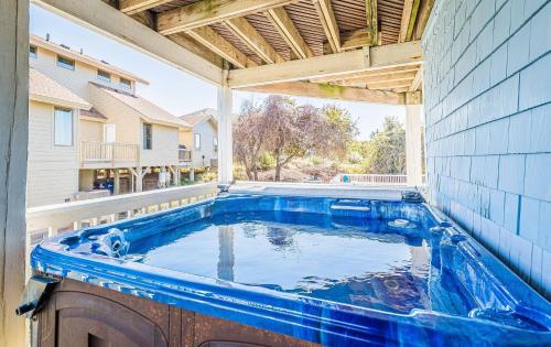 a swimming pool in the middle of a house at Sound Waves in Duck