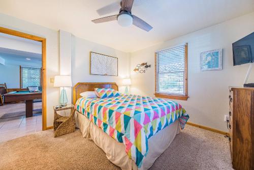 a bedroom with a bed and a living room at Sound Waves in Duck