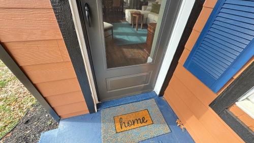 a door with a sign that says home at Lake view in Hampton