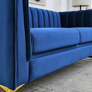 a blue couch sitting in a living room at Oxford Villa Apartment in Nnewi