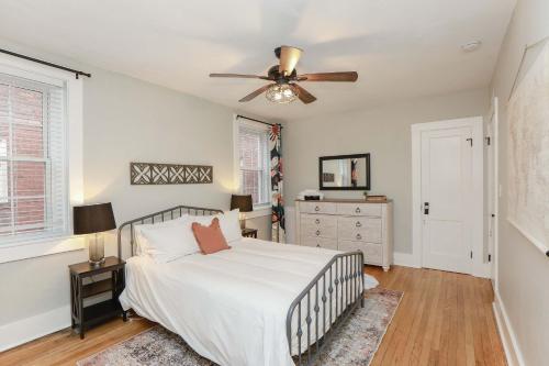 a bedroom with a bed and a ceiling fan at Sojourn at Colley Manor Unit 4 in Norfolk