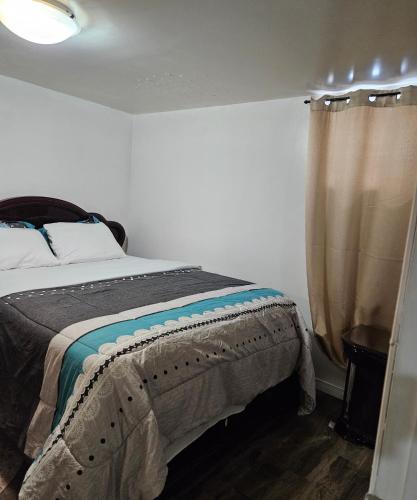 a bedroom with a bed and a window at Queen bedroom in Toronto