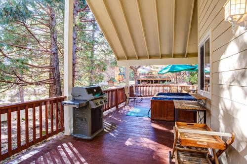 a screened in porch with a bbq and a grill at Miller's Landing in Wawona