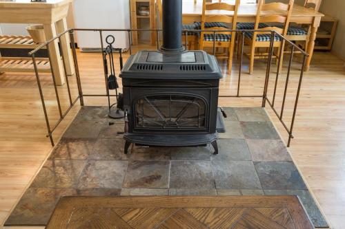 a stove sitting on a floor in a room at Wawona Chalet in Wawona