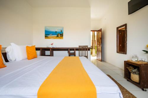 Giường trong phòng chung tại Hotel Maré Mansa