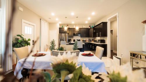 a living room with a table and a kitchen at Incredible King Bed Room Private Bathroom in Lithonia