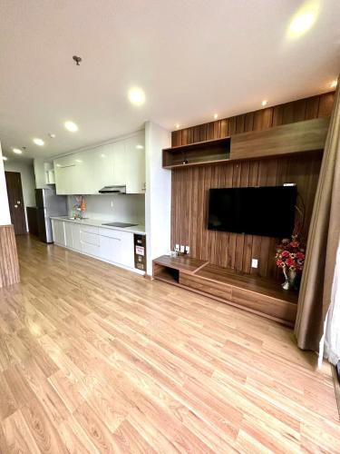 a large living room with a large flat screen tv at Reply 1996 Apartment in DaLat Center in Da Lat