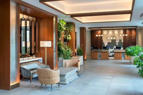 an office lobby with chairs and a reception desk at Westchester Marriott in Tarrytown