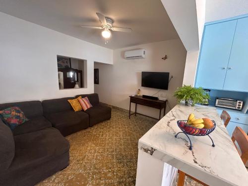 a living room with a couch and a table at Depas Azules Zona Centro Apt B in Mazatlán