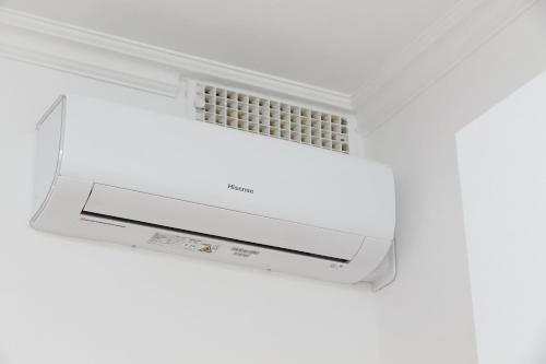 a white ceiling with an air conditioner in a room at Stella Polare Sensorial Home in Lido di Ostia