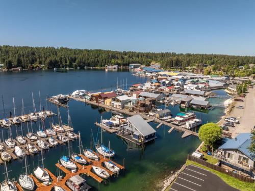 an aerial view of a marina with boats at Charming Waterfront Float Home with Panoramic Lake Views in Athol
