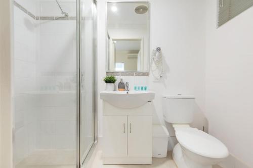 a bathroom with a toilet and a sink and a shower at A8 - Enjoy a romantic weekend at cozy studio apt in Perth