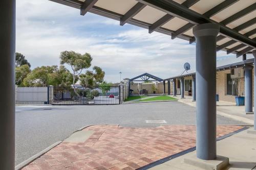 an empty street in front of a building with a gate at A6 - Work-from-home haven - free WIFI - 1BR in Perth