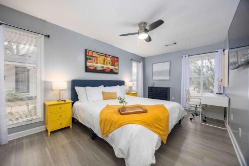 a bedroom with a bed and a desk in it at Midtown Modern Apt w Arcade 8 miles to FT Moore in Columbus