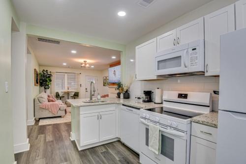 a kitchen with white cabinets and white appliances at Stylish APT 1mile To Masters 2mi Medical Center in Augusta