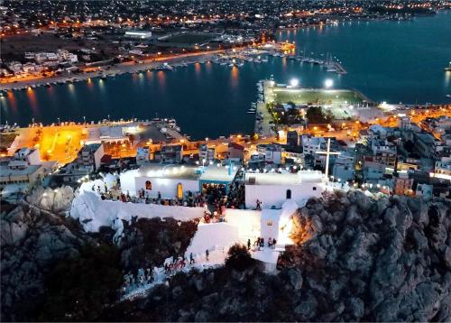 an aerial view of a city at night at Villa Aelia Luxury Maisonette in Salamís