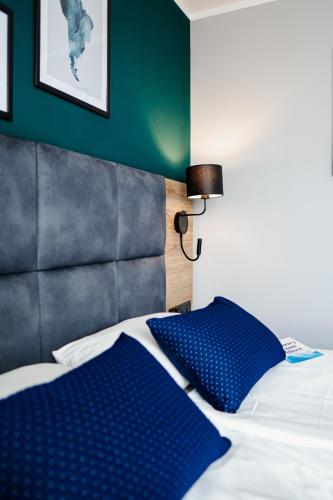Postel nebo postele na pokoji v ubytování Hotel Kyriad Stargard