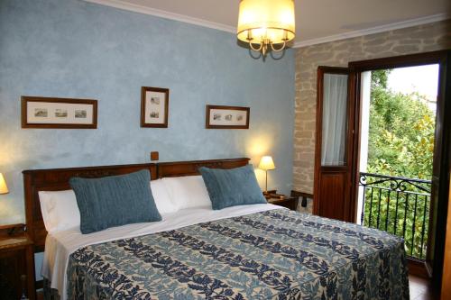 Postel nebo postele na pokoji v ubytování El Corral Del Acebo