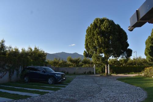 a car parked in the driveway of a house at Villa Cristal in Antigua Guatemala