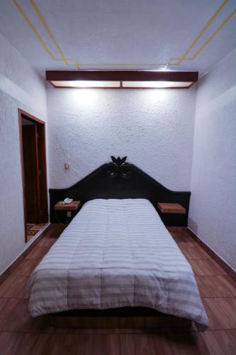 Postel nebo postele na pokoji v ubytování Hotel Central Teziutlan
