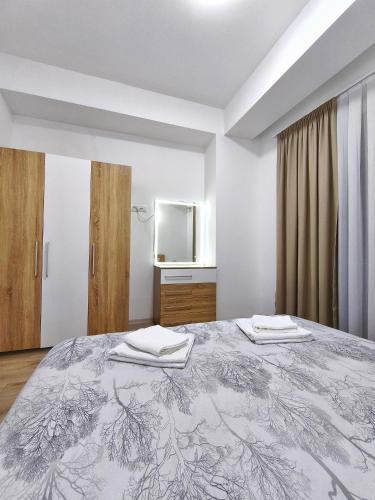 Postel nebo postele na pokoji v ubytování Aura apartment