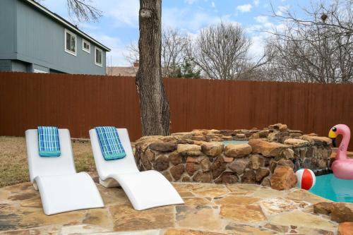 two chairs and a swimming pool with a toy duck at Pool,Games & Chill Vibes in Cedar Park