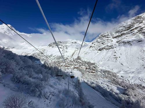 a ski lift going up a snow covered mountain at Les Greppes in Bonneval-sur-Arc