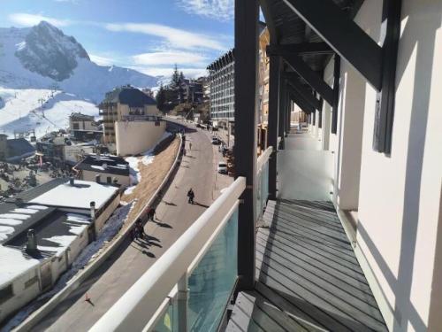a balcony of a building with a view of a mountain at Altitude 1800 - maeva Home - Appartement 4 Pièces 8 personnes - Confort MAE-2791 in La Mongie